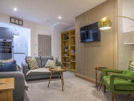 A living room with a sofa and coffee table at Moss Crag in Glenridding