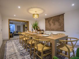 A dining room with a table and chairs at Moss Crag in Glenridding