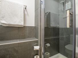 A bathroom with towels and a shower at Moss Crag in Glenridding