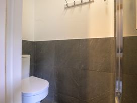 A bathroom with a toilet and a shower at Moss Crag in Glenridding