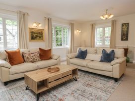 A living room with sofas and a coffee table at Cumbria house