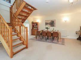 A dining room with a table and chairs at Cumbria house
