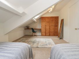 A bedroom with a bed and desk at Cumbria house