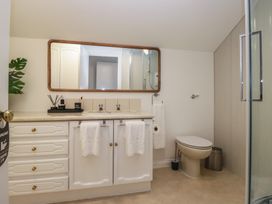 A bathroom with a sink and a toilet at Cumbria house