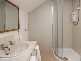 A bathroom with a sink and shower at Cumbria house