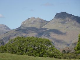 Mountains and greenery in a landscape with a clear sky at Cumbria house