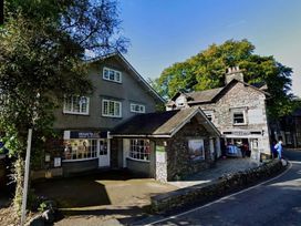 A street view showing shops and trees at Cumbria house in Grasmere