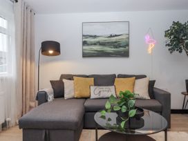 A living room with a sofa and a coffee table at Milana in Tiverton