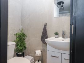 A bathroom with a toilet and sink at Milana in Tiverton