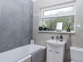 A bathroom with bathtub and sink at Milana in Tiverton