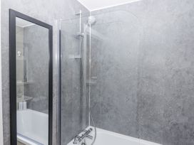 A bathroom with a shower and bathtub at Milana in Tiverton