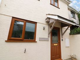 An exterior view of a house with a door and window at Surf View in Hope Cove