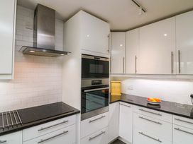 A kitchen with a cooking range and oven at Surf View in Hope Cove
