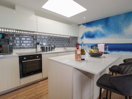 A kitchen with appliances and a fruit bowl at Penthouse @46Zinc - Headland View in Newquay