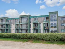 A building with balconies and greenery at Penthouse @46Zinc - Headland View Newquay