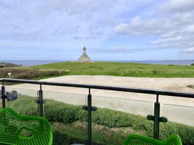 An outdoor area with a cross monument and sea view at Penthouse @46Zinc - Headland View Newquay