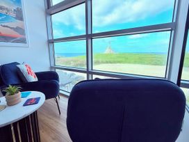 A living room with a view of the ocean at Penthouse @46Zinc - Headland View, Newquay