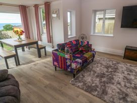 A living room with a sofa and dining table at St Marys in Penzance
