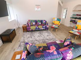 A living room with colorful furniture at St Marys in Penzance