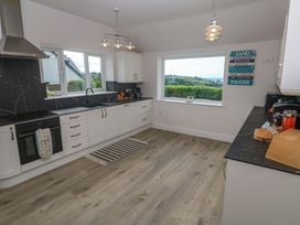 A kitchen with windows and a stove at St Marys in Penzance
