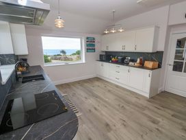 A kitchen with a window showing the sea at St Marys in Penzance
