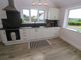 A kitchen with cabinets and a sink at St Marys in Penzance