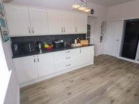 A kitchen with appliances and cabinets at St Marys in Penzance