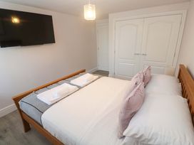 A bedroom with a bed and television at St Marys in Penzance