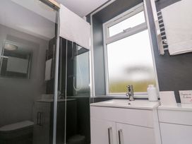 A bathroom with a shower and sink at St Marys in Penzance