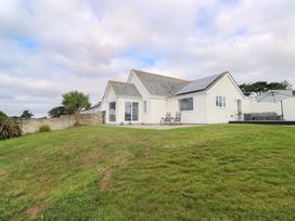 A house with solar panels and seating area at St Marys Penzance