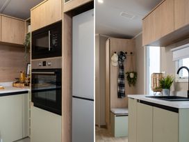 A kitchen with appliances and storage at Arlington 40 x 14 Two Bed