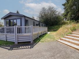 A house with a decking area and steps at The Pines 2 Bedrooms Delamere