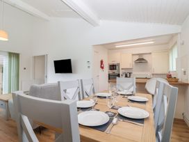 A dining room with a table set for meals at Harcombe House Bungalow 25 Chudleigh