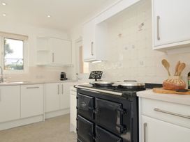 A kitchen with an oven and countertop at 42 Little Trelyn Wadebridge