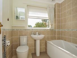 A bathroom with a sink, toilet, and bathtub at 42 Little Trelyn Wadebridge