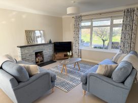 A living room with sofas and a coffee table at 42 Little Trelyn, Rock