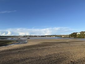 A view of a beach with boats at 42 Little Trelyn in Rock