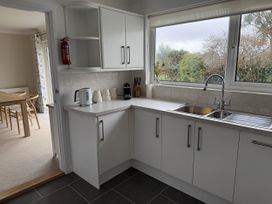 A kitchen with sink and kettle at 42 Little Trelyn in Rock
