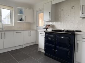 A kitchen with an oven and sink at 42 Little Trelyn Rock