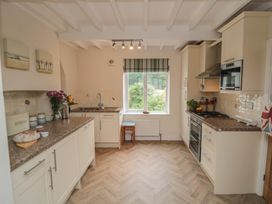 A kitchen with a sink and stove at Iveridge Sandsend