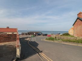 An outdoor view of a road leading to the ocean at Iveridge Sandsend