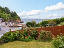 An outdoor area with a view of the sea and greenery at Zide the Zea Hele Bay, Ilfracombe