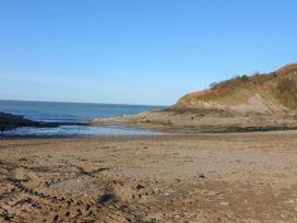 A beach with rocks and a hill at Zide the Zea Hele Bay, Ilfracombe