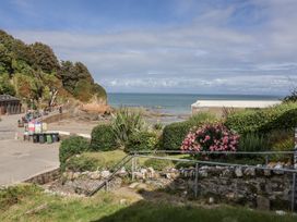 A coastal view with a pathway and plants at Zide the Zea, Hele Bay, Ilfracombe