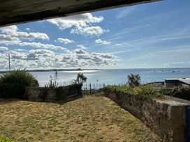 A view of the sea and clouds from a garden at 1 Penrose Court in Penzance