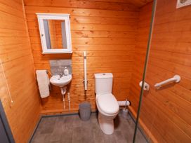 A bathroom with a sink and toilet at Stumps Cross Lodge Upper Coscombe near Winchcombe