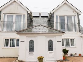 A building facade with doors and windows at Fistral Palms 2