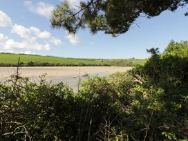 A view of a shoreline with boats in the water at Fistral Palms 2 