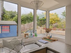 A kitchen with a sink and various items on the counter at 20 Lym Close Lyme Regis