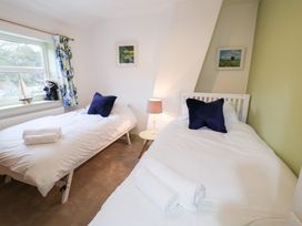 A bedroom with two single beds at Deben Road in Woodbridge